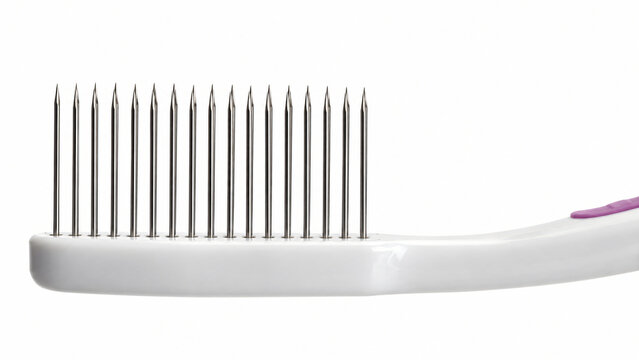 Toothbrush with Sharp Needle Bristles Isolated on White Background concept idea paintful