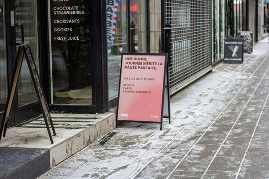 Canada, Montreal, 22 December 2025 : Bistro entrance, menu display, gelato, cafes, snowy city street scene