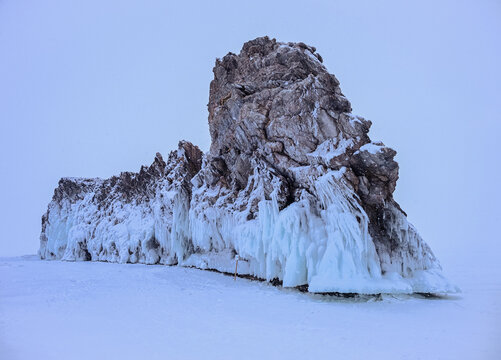 The Dragon tail rock while snowing located at Ogoy island in frozen lake Baikal in winter season.