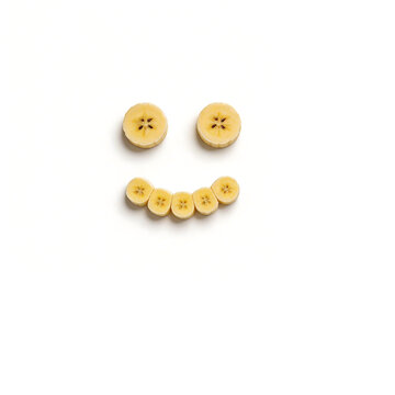 Banana slices arranged as a smiley face