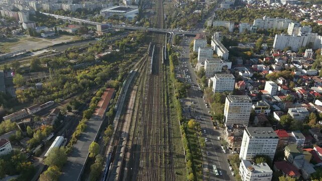 Multiple Trains Arrive Bucharest North Railway Station Late Afternoon Romania Drone High Angle Descend 4K 60FPS