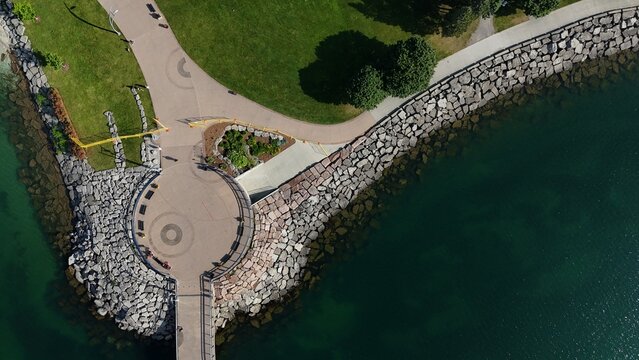 Aerial View of Waterfront Park Pier and Rocky Shoreline on Lake Ontario
