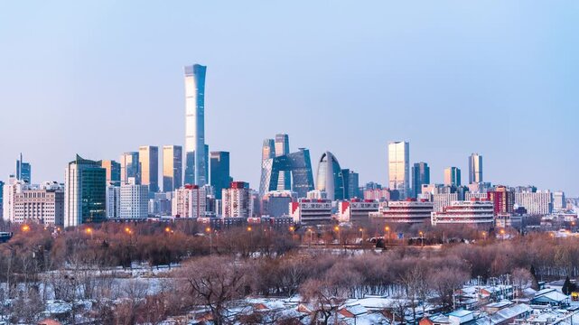 Winter sunrise timelapse of CBD skyscrapers and Red Scarf Park in Beijing, China