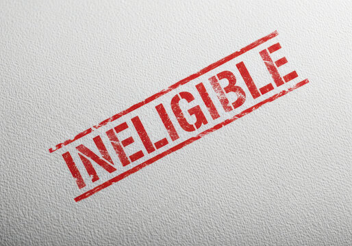 Red Ineligible stamp text on a flat surface for business document review