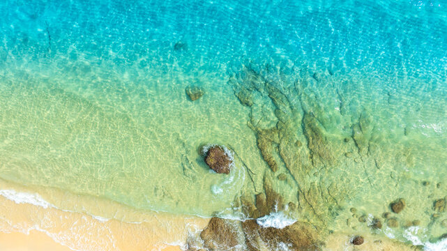Nature of the ocean and blue sky Summer with sunshine, sandy beaches, clear blue waters sparkling against the blue sky. on an island with good ecology and environment Background for summer vacation