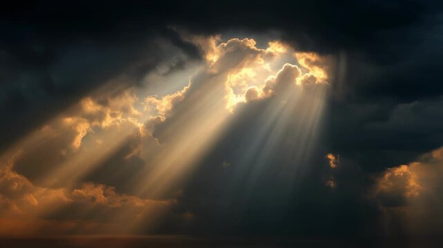 Golden sun rays piercing through dramatic dark clouds illuminating the sky with warm light