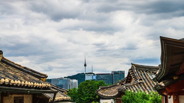 This 4K time-lapse video showcases the charm of Bukchon Village as a wonderful destination during the rainy season, capturing the atmosphere of a day with changeable weather in Seoul, South