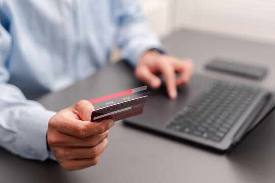 Loyalty program and membership tier concept. Businessman holding credit card with VIP upgrade progress bar.