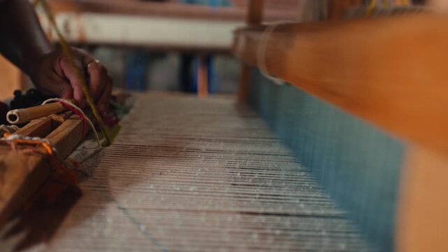Close up of traditional textile weaving on a wooden loom