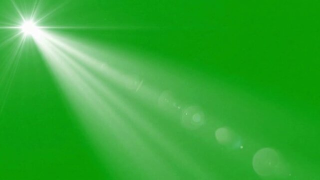 Bright white star flare light beam effect on green screen background lens glow shimmer sparkle