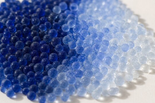 Blue desiccant beads color transition, from moist to dry state.