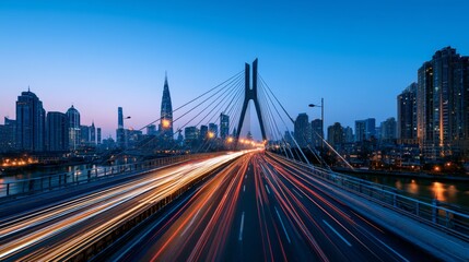 Fototapeta premium Vibrant City Skyline at Dusk with Light Trails from Moving Traffic on a Modern Bridge Over Water in an Urban Setting