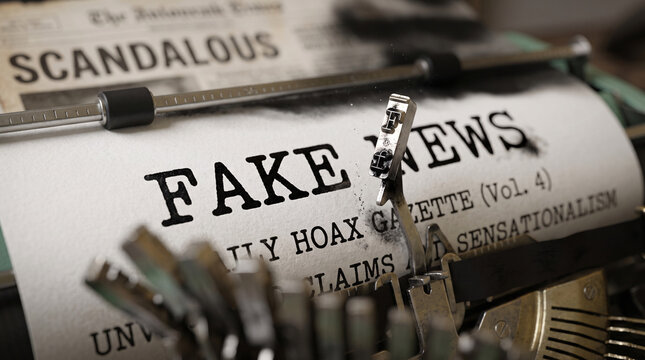 Fake News printed on typewriter paper inside an old office