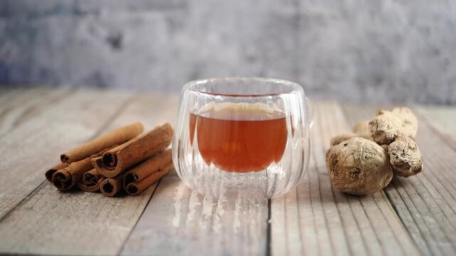 Making ginger tea with cinnamon and fresh ginger root