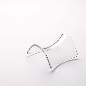Minimalist quantum tensor glass hyperbolic paraboloid saddle node with crystal refraction on white surface square