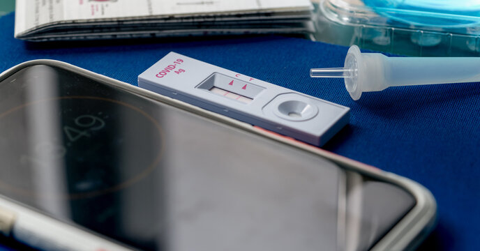 Covid 19 antigen self-test for nasal swab with positive result. Antigen test kit for home use to detection coronavirus infection. Positive test result from rapid antigen test. Coronavirus diagnosis.