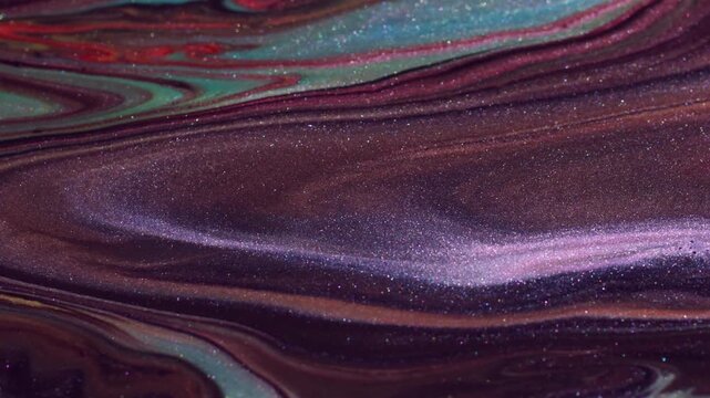 Dirty dye leak. Art liquid. Glitter acrylic flow dissolving defocused paint shimmering. Black red green abstract color background.