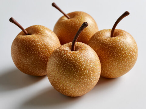 Fresh Nashi Pears with Textured Skin Isolated on White Background