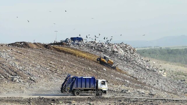 Garbage Truck and Bulldozer Working at Municipal Landfill, Household Waste, Environmental Pollution and Waste Management