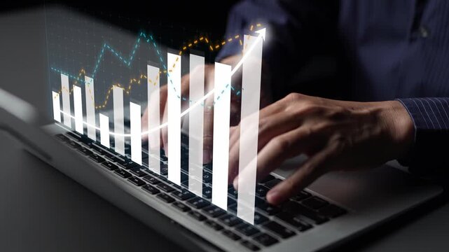A businessman engages in data analysis on a laptop. The image showcases various graphs and charts representing growth, emphasizing modern business technology and workspace. Copula