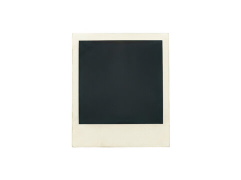 Old vintage polaroid photo frame with a blank dark center