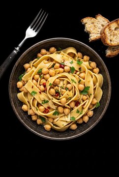 Generated ai Lagane e Cicciari is a thick, flat pasta.