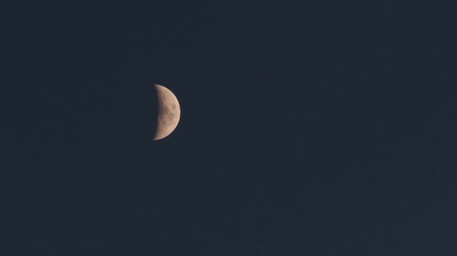 Tokyo,Japan - June 20, 2026: Half moon observed soon after the sunset