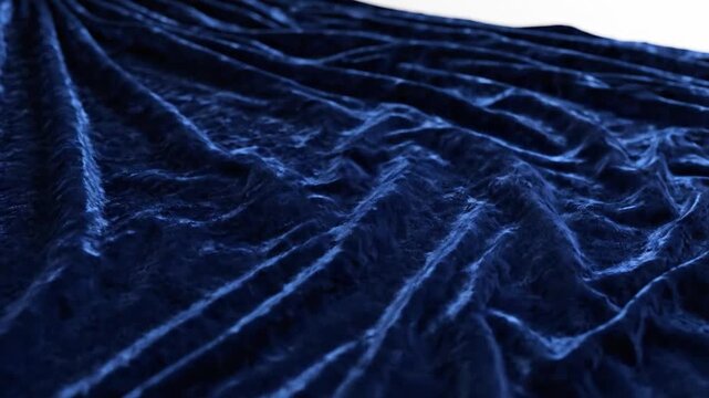 Elegant and opulent deep blue velvet textile with graceful drapes and luxurious shimmering folds, perfect for sophisticated backgrounds and seamless design loops
