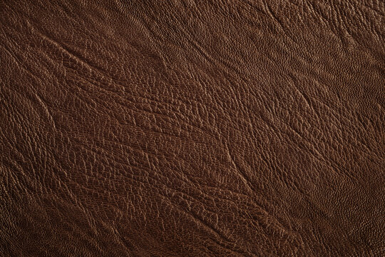 Dark brown leather texture background with seamless pattern and high resolution.