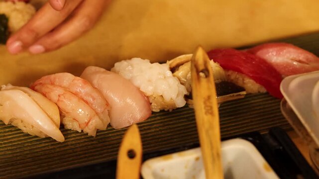 Chef Preparing Fresh Nigiri Sushi Platter in Japanese Restaurant
