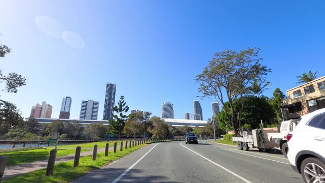 Driving Through Sunny Gold Coast Suburban Streets Toward City Skyline