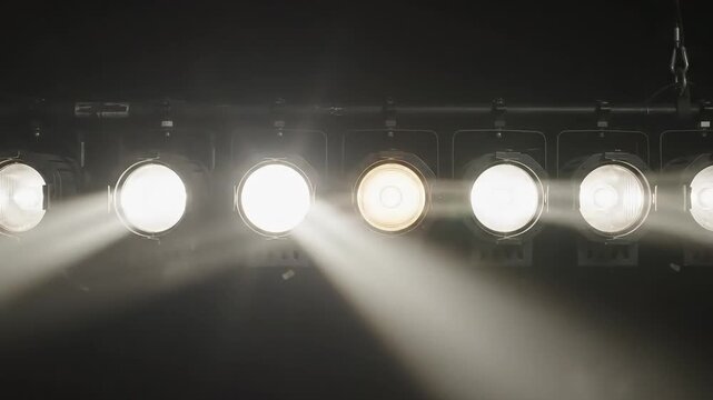 Stage lights turning on and shining into the camera
