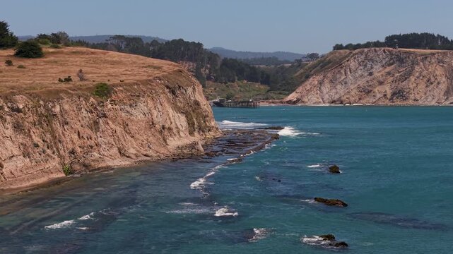 Watch the cliffs and waters around Point Arena Fishing Pier, located near the lighthouse and south of Mendocino in California.