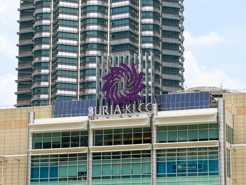 Kuala Lumpur, Malaysia - April 12, 2026: Suria KLCC Mall Exterior Facade with Petronas Twin Tower and Kinokuniya Sign