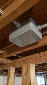 Nonmetallic electrical junction box secured tightly to joists ceiling frame