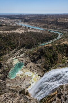 Huge waterfall with turquoise rockpools, Wadi Darbat, Salalah, Oman