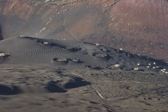 Black and brown lava landscape, many small craters, Timanfaya National Park, fire mountains, volcanic landscape, Lanzarote, Canary Islands, Spain