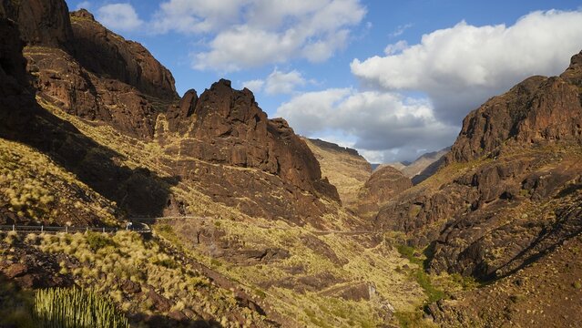 Serpentine road, mountain, mountainside, blue sky, white clouds, Barranco de la Aldea, gorge, Gran Canaria, Canary Islands, Spain