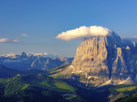 Sassolungo with clouds, behind the Pala, Dolomites, South Tyrol, Italy