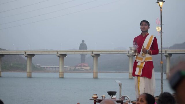 Narmada Aarti ceremony by the river showcases a sacred Hinduism ritual, echoing Ganga Aarti traditions and drawing tourism near Statue of Unity during Diwali with devotion, prayer and spiritual faith.