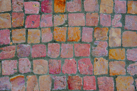 Sidewalk paved with colored cobblestones