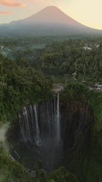 Aerial view of Mt.Semeru with Tumpak Sewu waterfall is one of the most stunning waterfalls in Indonesia, standing at 120 meters tall with the most insane panorama view.