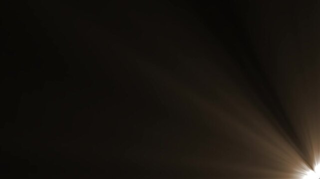Warm vintage golden sunbeams projecting from bottom right corner towards center loop.