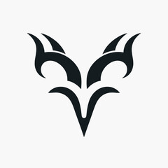 Fototapeta premium A stylized black tribal symbol resembling a horned creature or abstract design.