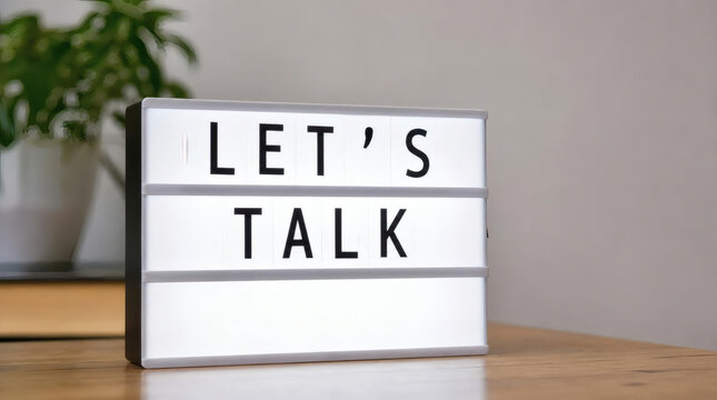 lets talk speech bubble sign on brick wall background communication and conversation concept business coaching mental health support open dialogue team building counseling services talking therapy rel