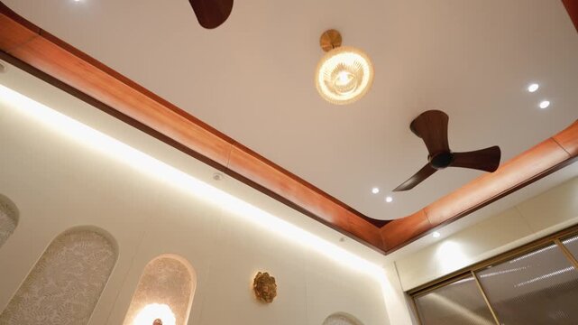 Modern interior ceiling with rotating wooden ceiling fans