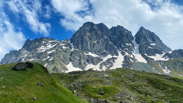 Chaukhi peaks dominate Georgia's Caucasus highlands, combining sheer rock walls, snow gullies and alpine terrain