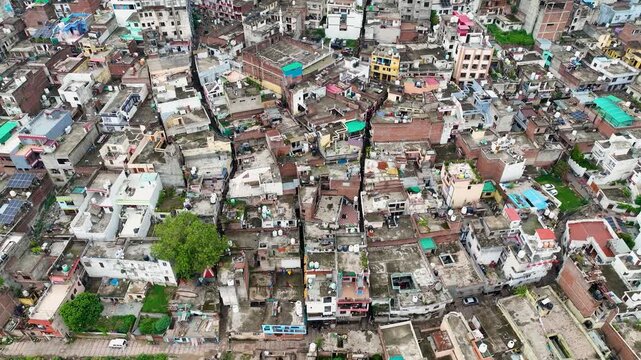 Tawi river rainy season Jammu establishing shot, showing riverfront development, steep banks and vulnerable riverside settlements