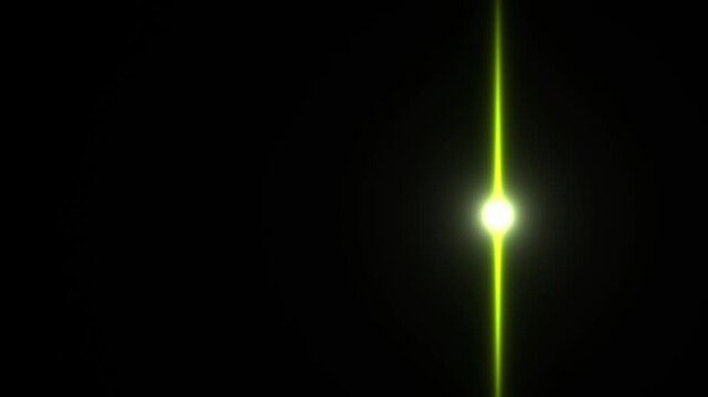 A bright green light beam shines through a dark space. The light creates a striking contrast against the black background. It appears dynamic and radiant, highlighting a narrow path of brightness