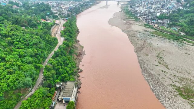 Drone view of Jammu floods during monsoon, highlighting climate vulnerability and dense settlements along the Tawi River.